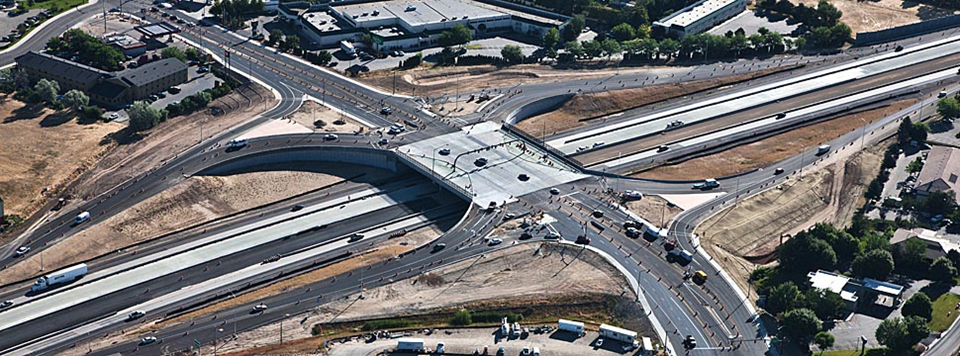 aerial shot of freeway and overpass