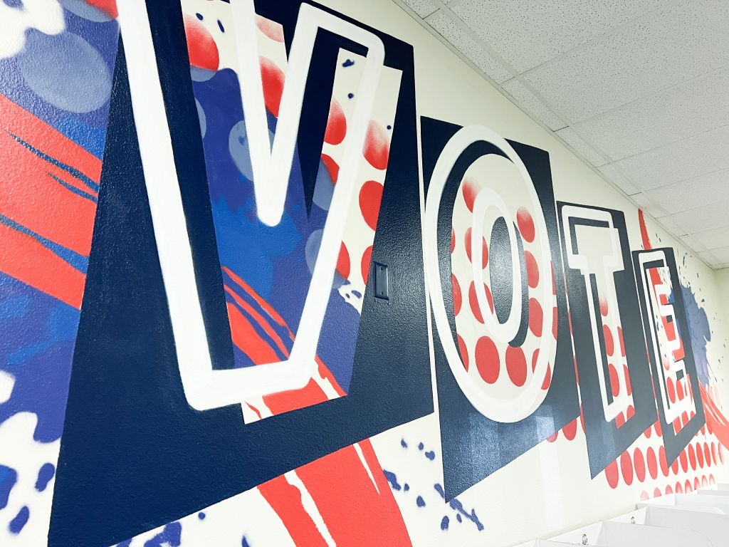 wall with vote painted in large letters