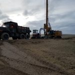 Tractors digging gas wells