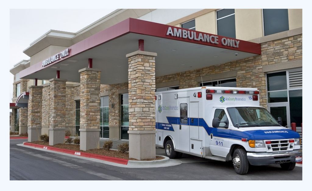 Ambulance Under Cover Of Hospital