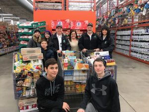 Ada County Paramedics employees fill three shopping carts full of food for local families in need.