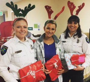 Ada County Paramedics Employees delivering toys to hospitalized children