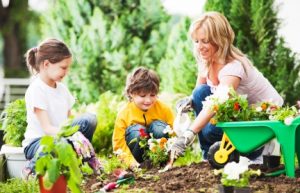 mother and children planting flower
