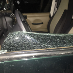 Broken Glass on Drivers Side Vehicle with Tan interior