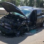 Black Dodge Truck Crashed Missing Drivers Side Wheel