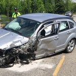 Silver Dodge Caliber Crashed with Missing Drivers Side Wheel