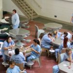 female inmates gather at tables