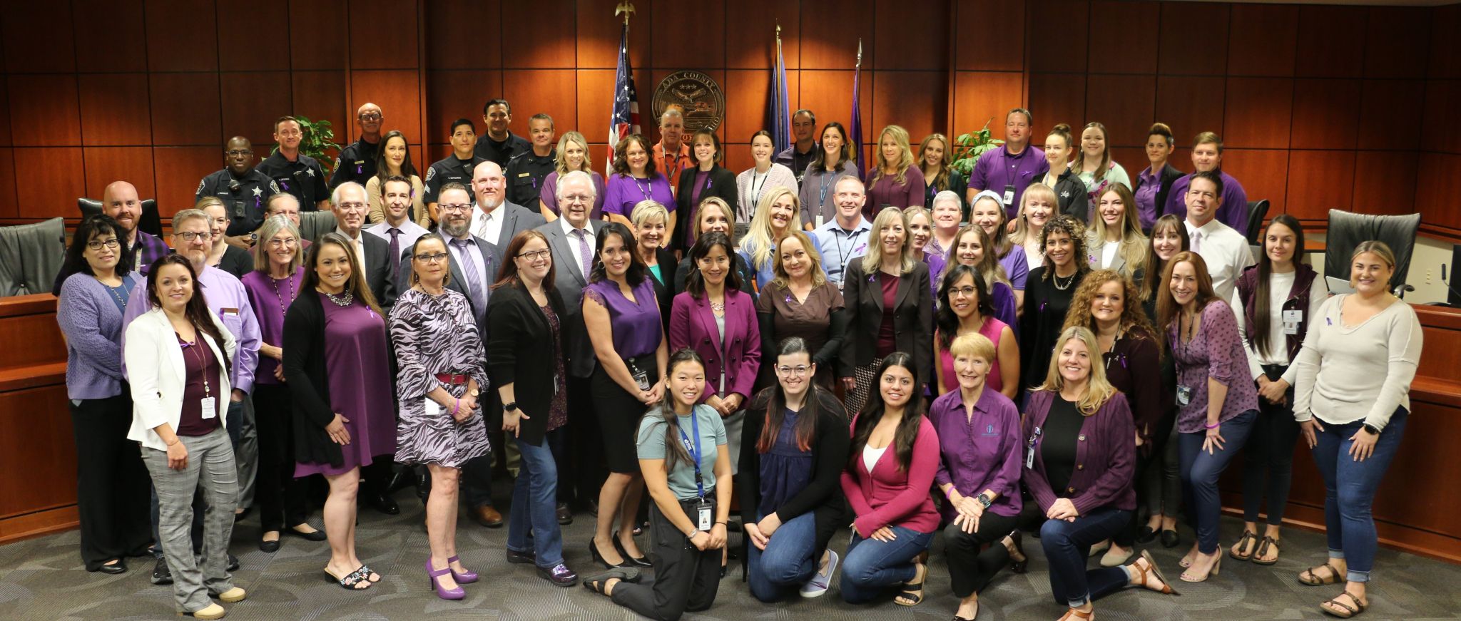group of people supporting Domestic Violent awareness month by wearing purple